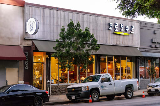 a white truck parked in front of a store