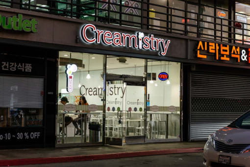 a store front with a sign that reads cream city