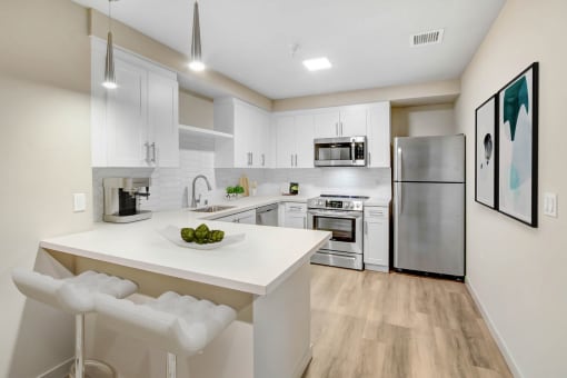 the preserve at ballantyne commons apartment kitchen with island and stainless steel appliances