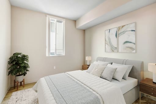 a bedroom with a large bed and a window