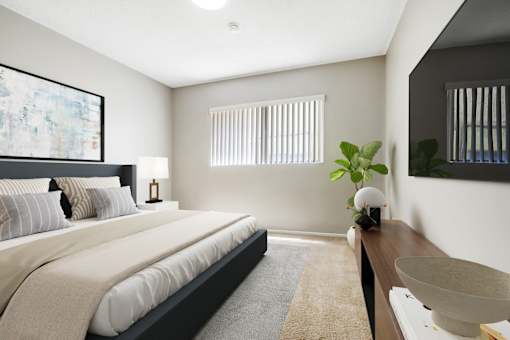 A bedroom with a large bed and a painting on the wall.