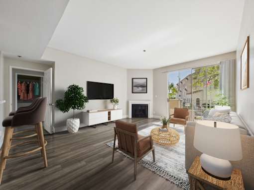 A modern living room with a fireplace and a flat screen TV.
