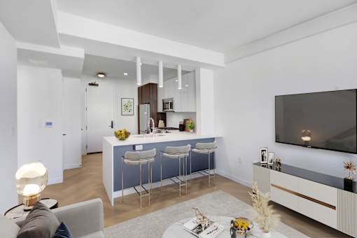 A modern living room with a bar area and a television.