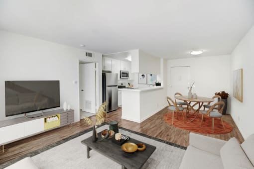 a living room with a couch and a table and a television