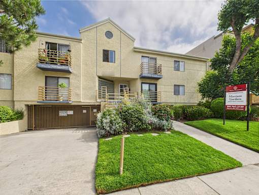Apartments with a sign that says Mortgage Garden.