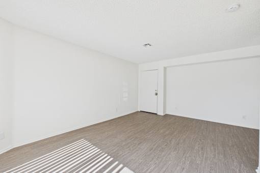 A room with a striped rug on the floor.