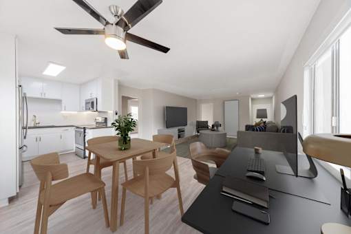 A modern kitchen with a dining table and chairs.