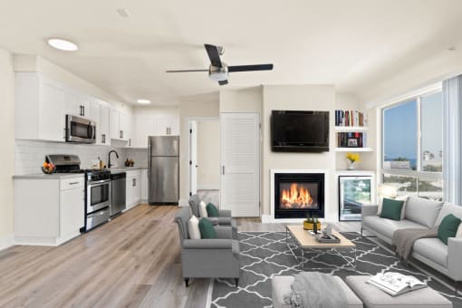 a living room with a fireplace and a kitchen with a stove and refrigerator