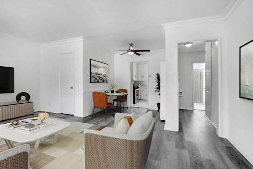 A living room with a white couch and a coffee table.