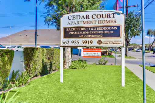 Cedar Court Apartment Homes signage, Bachelors, 1 and 2 bedrooms, private patios, cable/DSL Ready, air conditioning, 562-925-5919