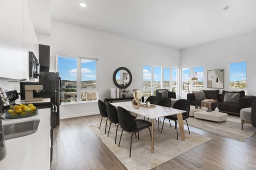 an open living room and dining room with a table and chairs