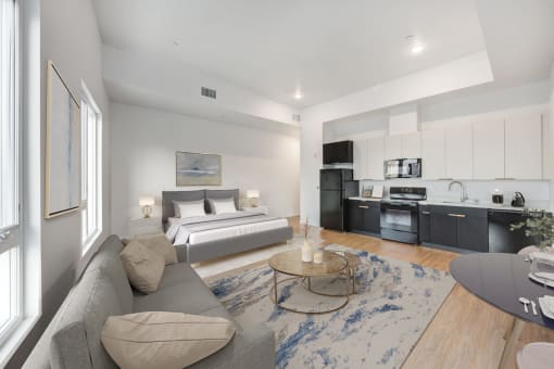 a bedroom with a bed and a couch in a living room