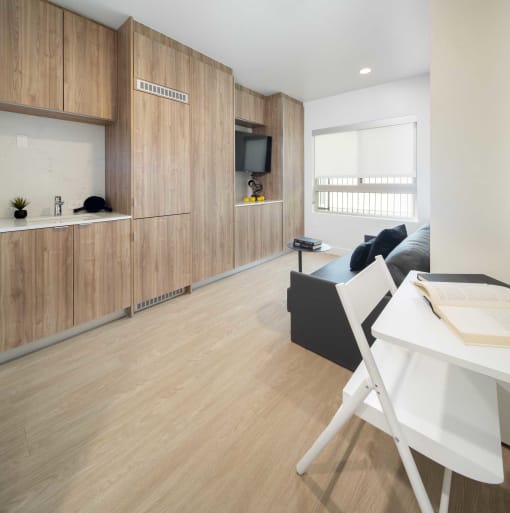 a kitchen and living room in a small apartment