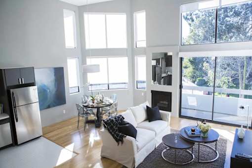 Cozy living room with fireplace at 888 Hilgard apartments in Westwood Los Angeles