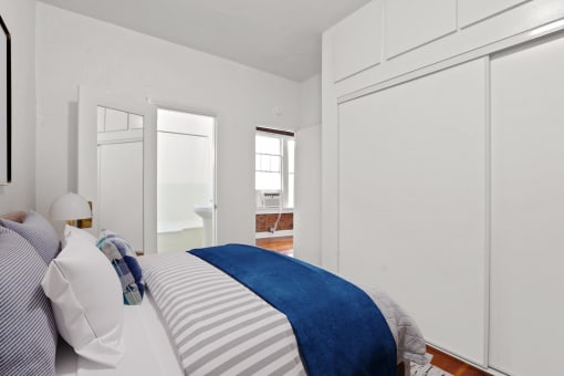 a bedroom with a bed and a closet