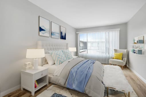 a bedroom with a large bed and a window