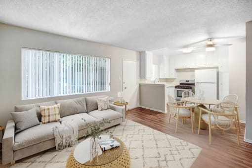 an open living room and kitchen with a couch and a table