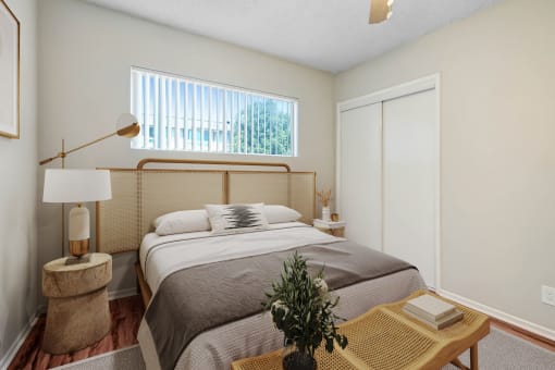 a bedroom with a bed and a window