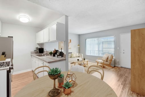a living room with a dining room table and a kitchen