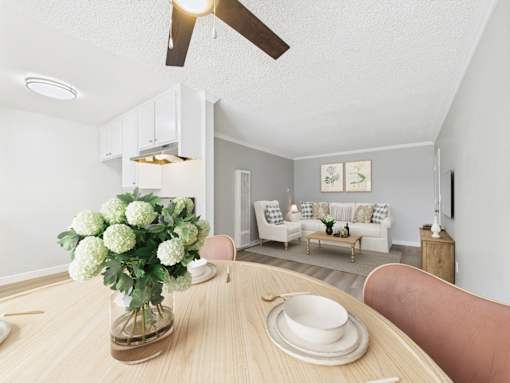 A dining room with a wooden table and chairs.