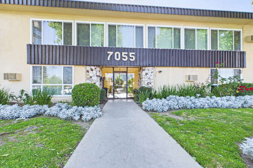 A building with the number 7055 on the front.