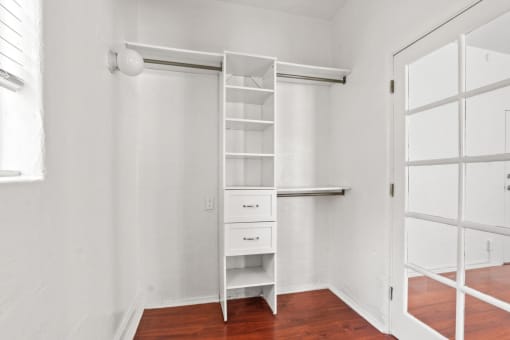 a room with a closet and a ladder on the wall
