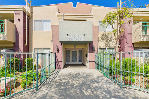 The image shows the front of a building with the number 9601 on it.