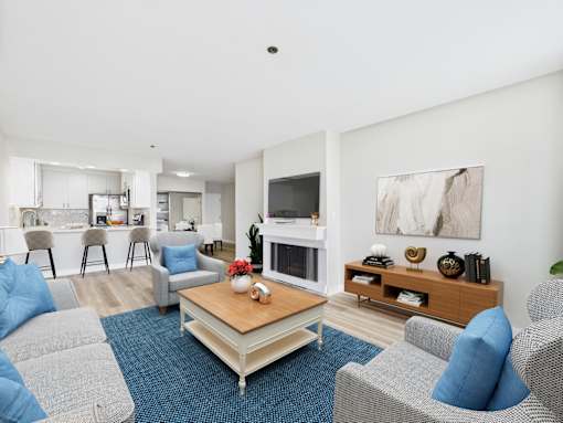 A living room with a grey couch and a coffee table.