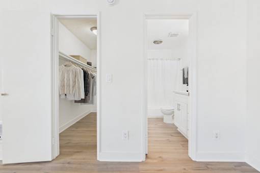 A white bathroom with a toilet and sink.