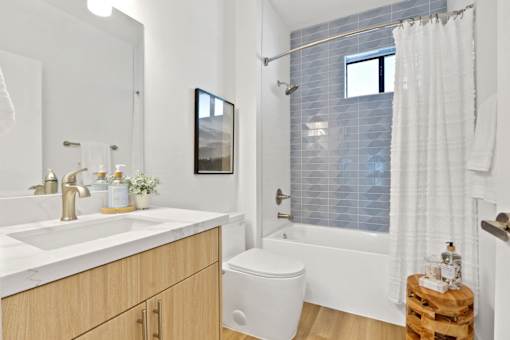 A bathroom with a white toilet and a white sink.