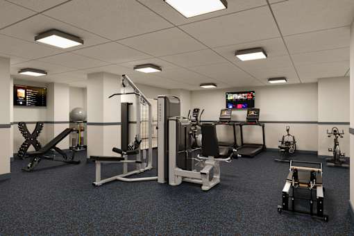 Stylish fitness center with modern finishes and functional layout