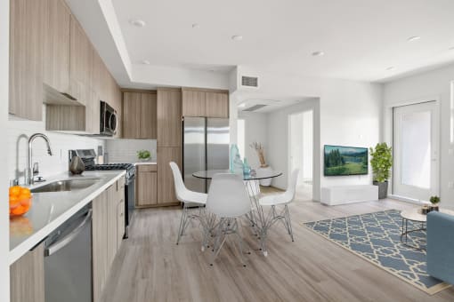 a kitchen and dining area in a 555 waverly unit