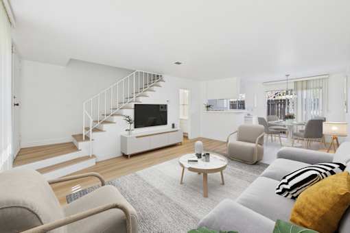 A living room with a grey couch and a coffee table.
