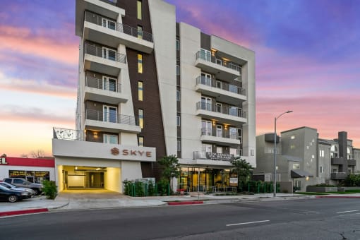 an image of an apartment building on a city street