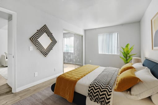 a bedroom with a bed and a sliding glass door