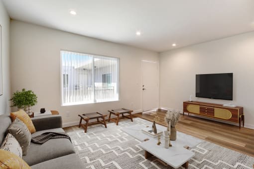 a living room with a couch and a tv