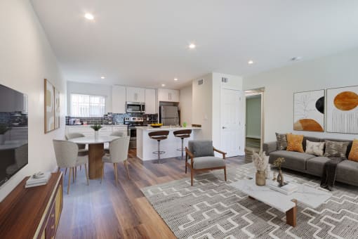 a living room with a kitchen and a dining room