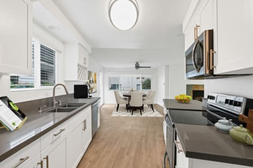 a kitchen and dining area in a 555 waverly unit