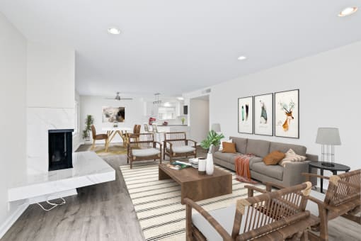 a living room with white walls and hardwood floors