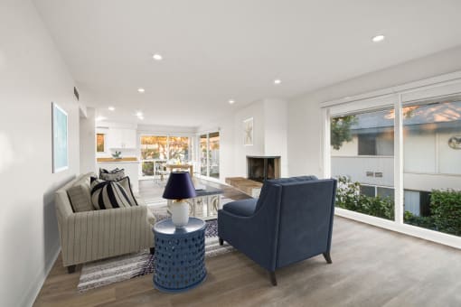 a living room with a couch and two chairs