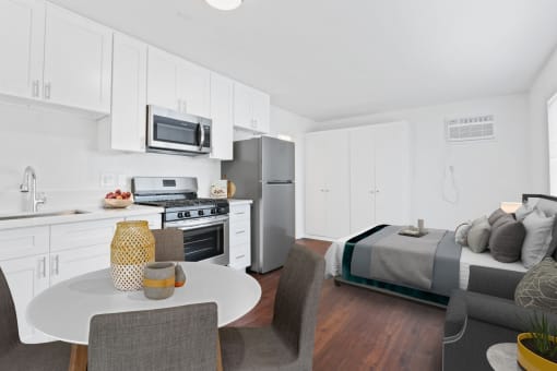 a kitchen and dining area in a 555 waverly unit