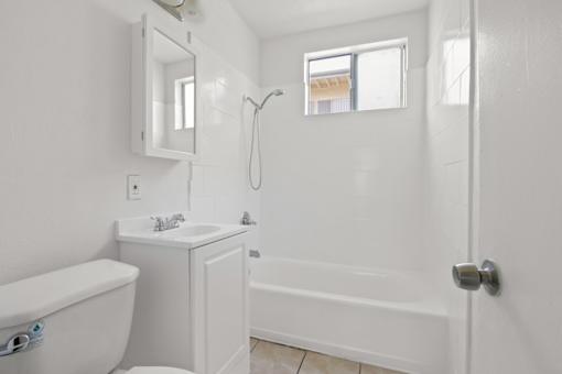 a bathroom with a sink toilet and a shower