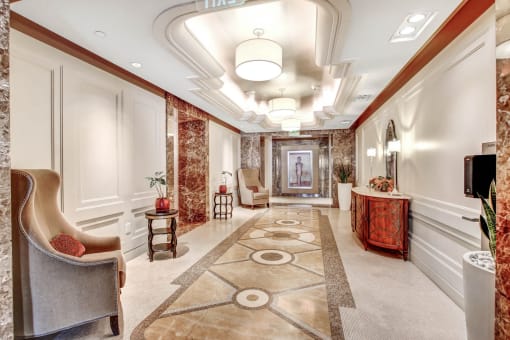 a hallway with chairs and a television and a rug
