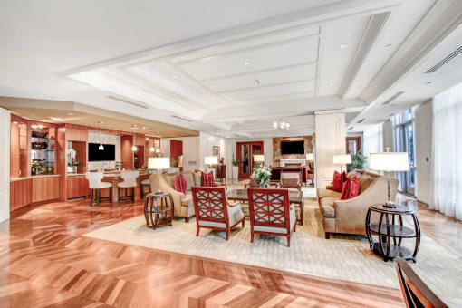 a living room filled with furniture and a dining room