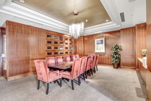 a dining room with a table and chairs and a chandelier