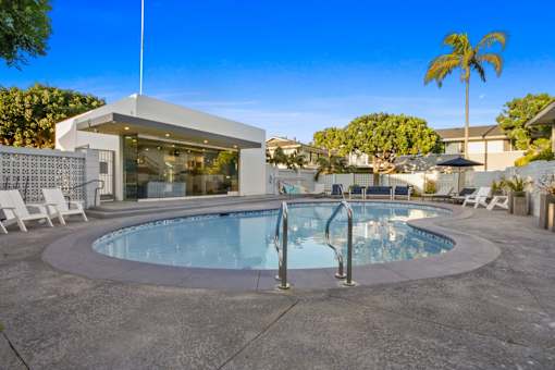 A modern house with a swimming pool in the backyard.
