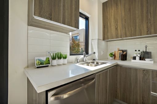 a kitchen with a sink and a window