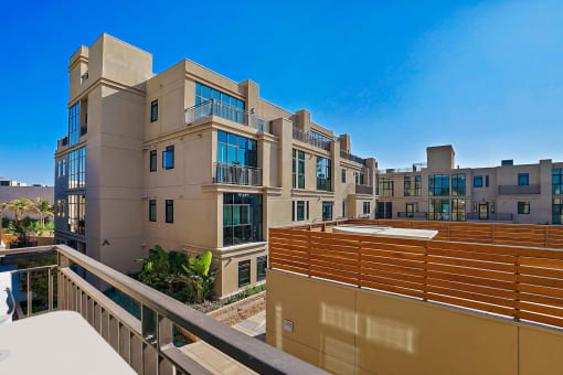 a view from the balcony of an apartment building with a balcony