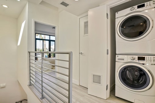 a washer and dryer in a laundry room with a door