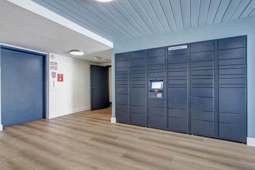 a row of lockers in a room with a blue ceiling